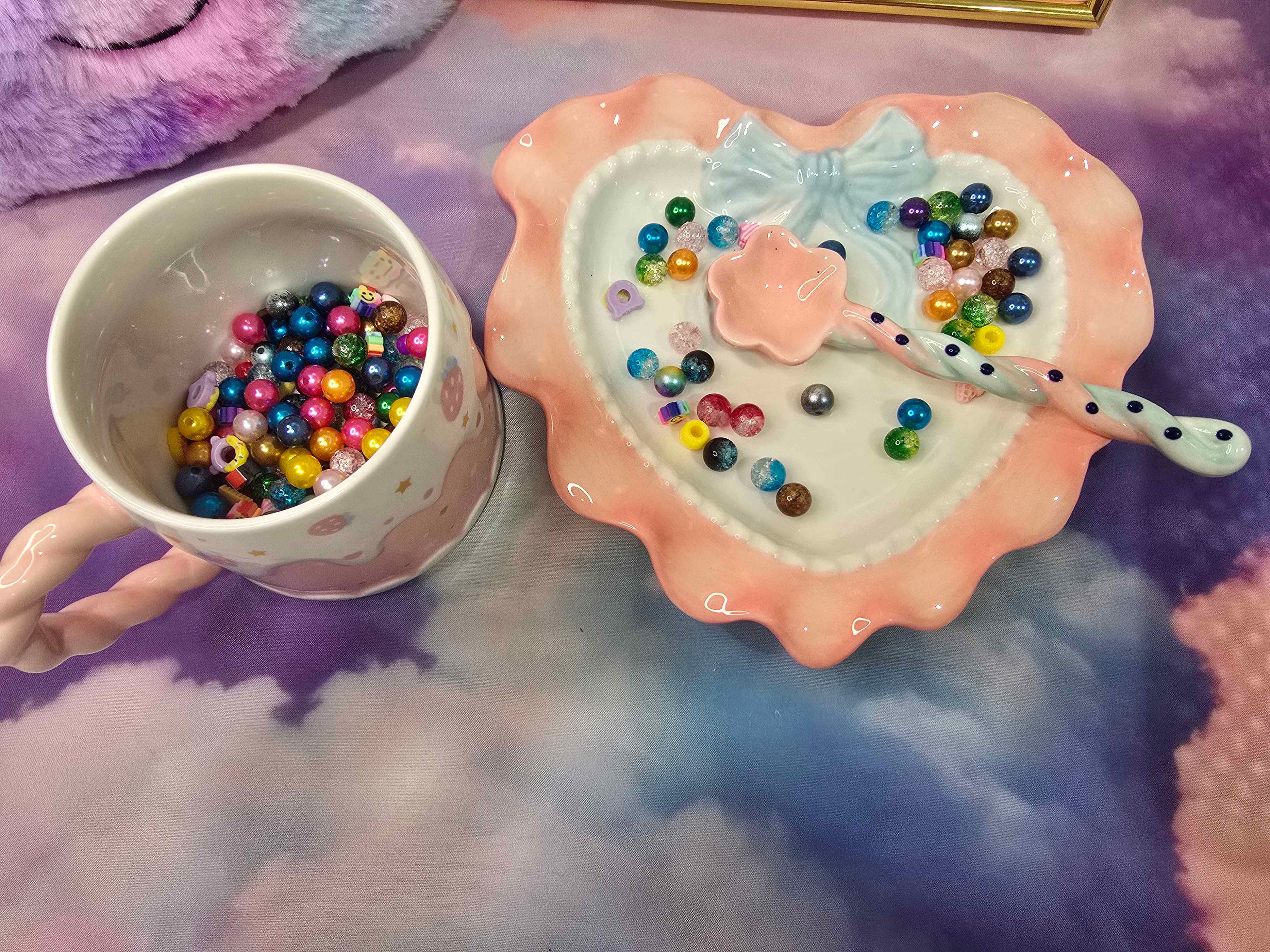 Ceramic bowl with colorful beads on a textured surface