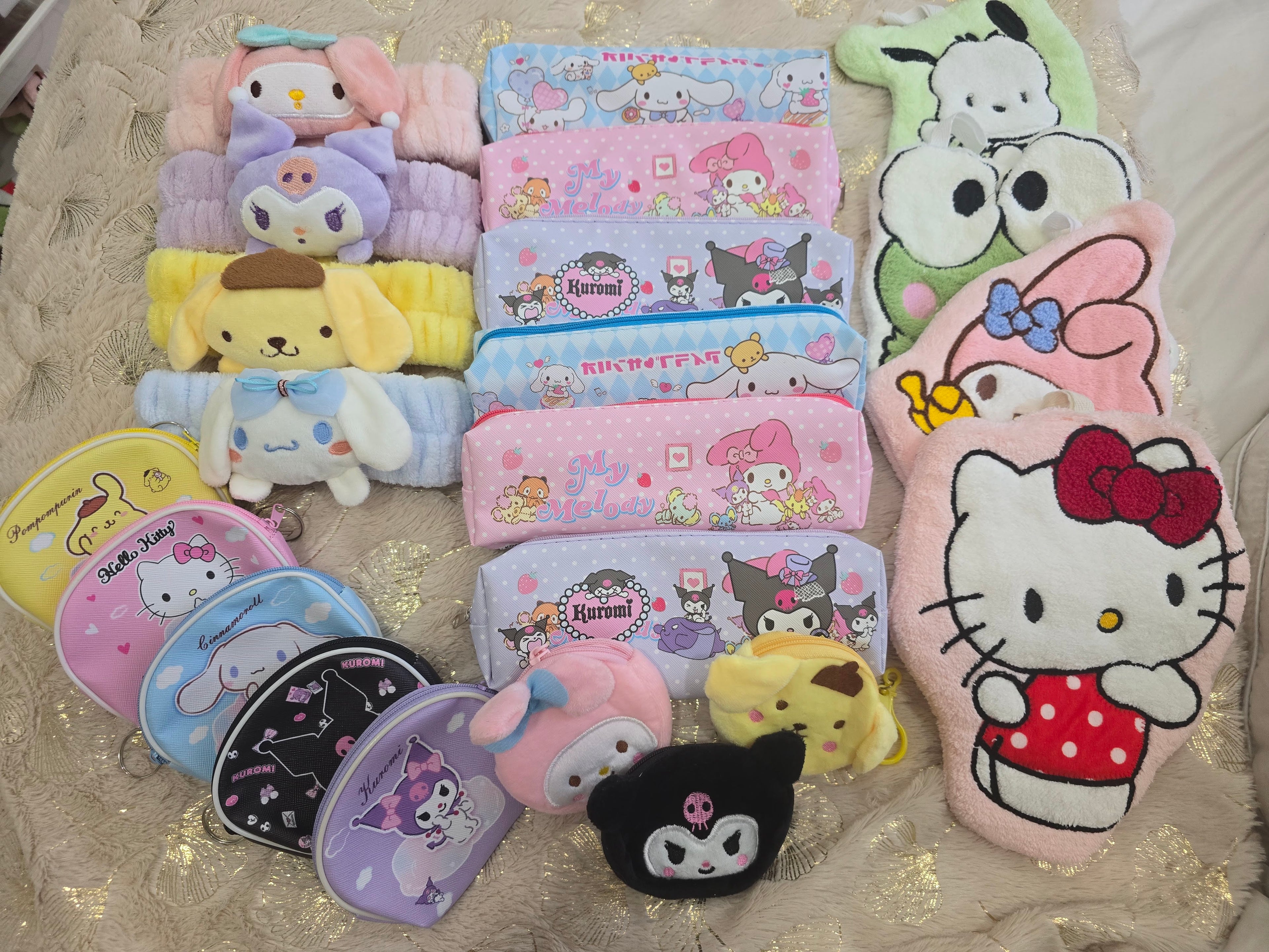 Collection of colorful cartoon-themed pouches on a textured surface